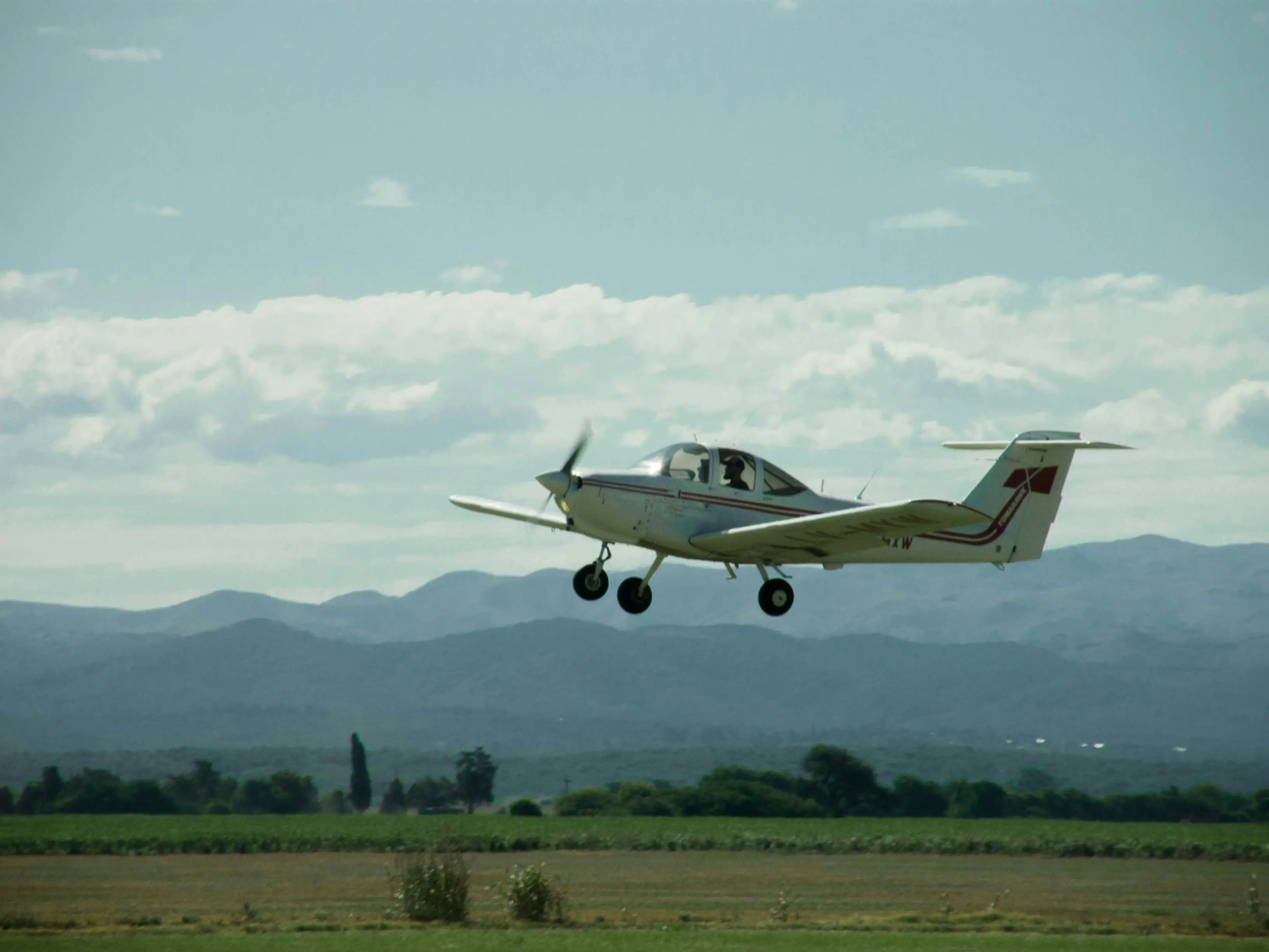 Airplane departing from field by Giuliano Gastaldi