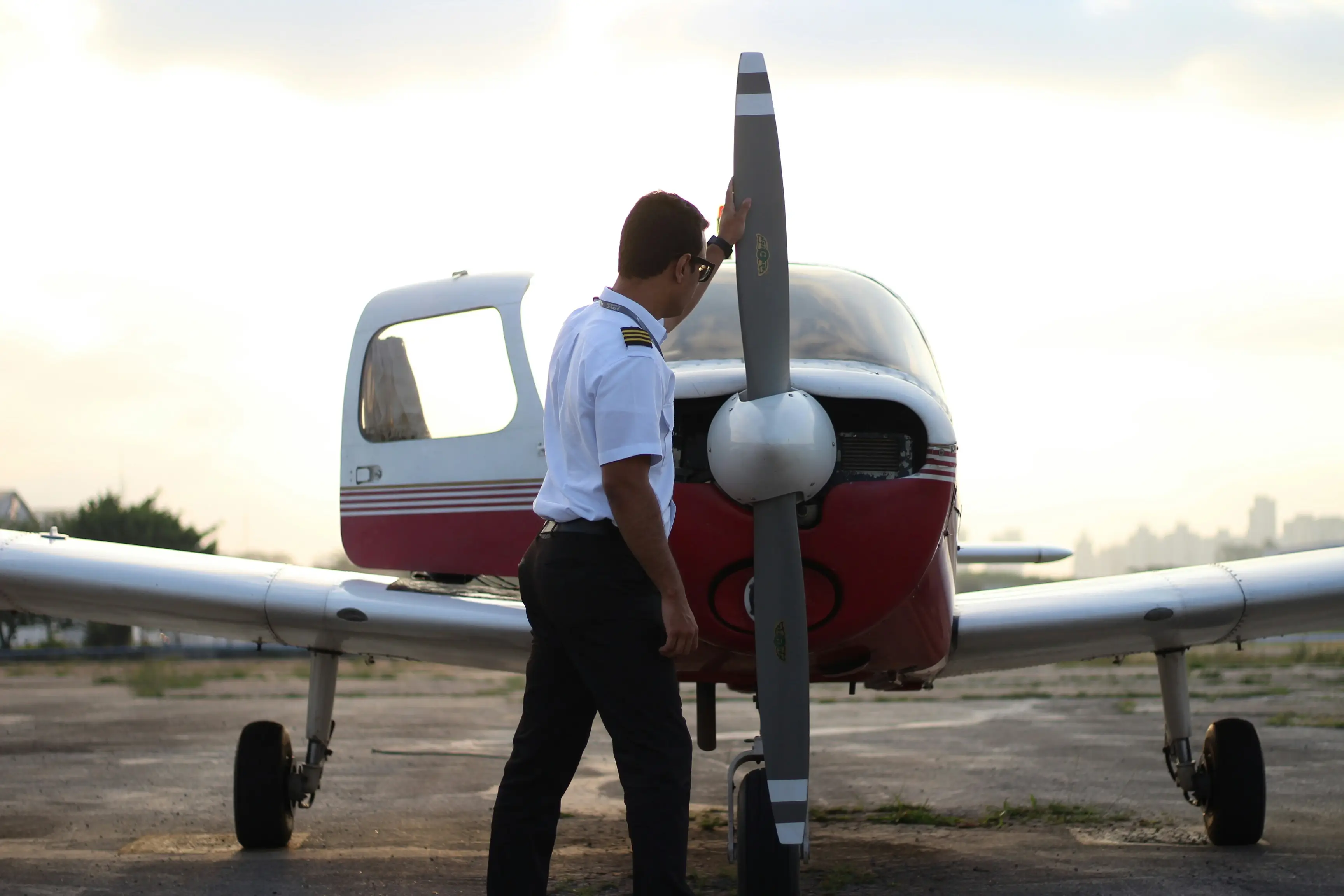 Pilot near aircraft propeller by Luciano Faiolo