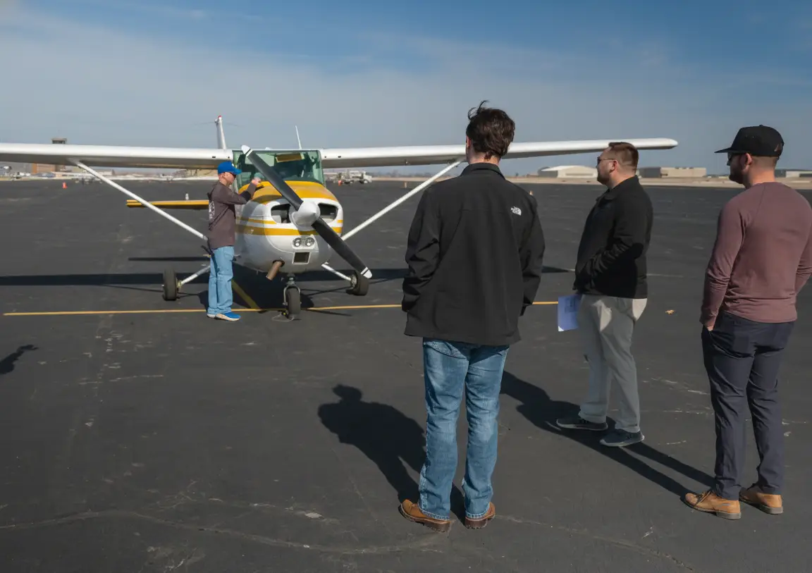 Pilot Instructional Center New Century KS - CFIs preparing Cessna plane at airport near Kansas City MO