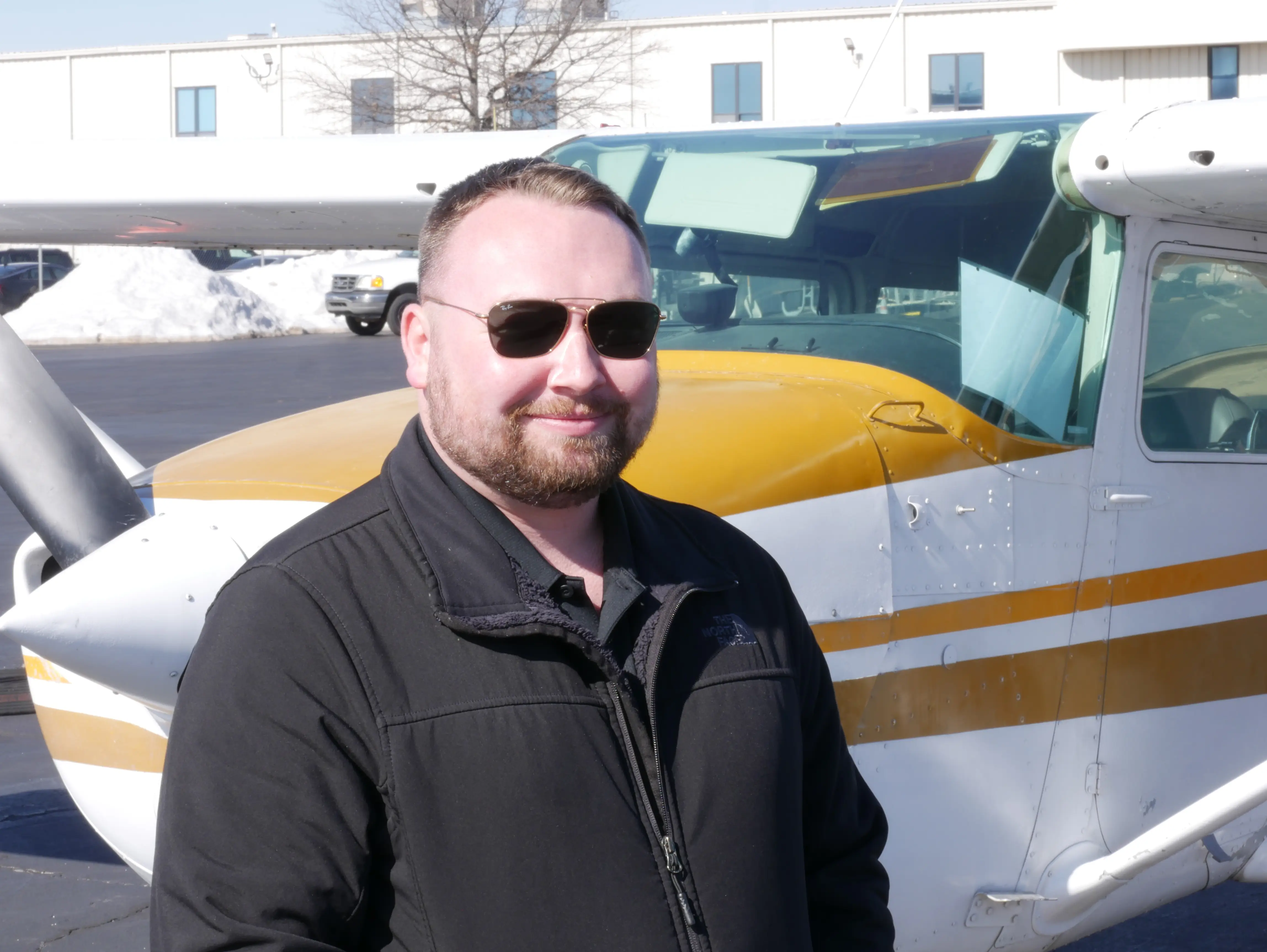 Pilot Instructional Center New Century KS - Ryan Tindall CFI with Cessna in background