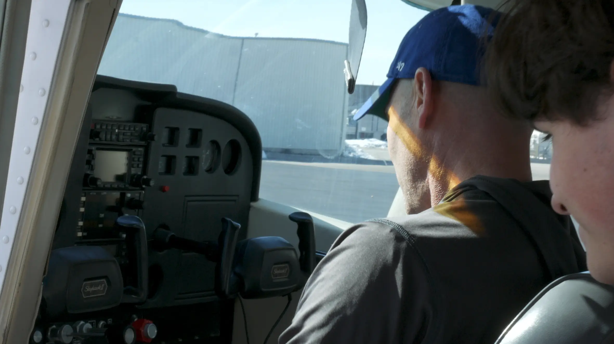 Pilot Instructional Center - Pilot checking cockpit instruments during pilot training