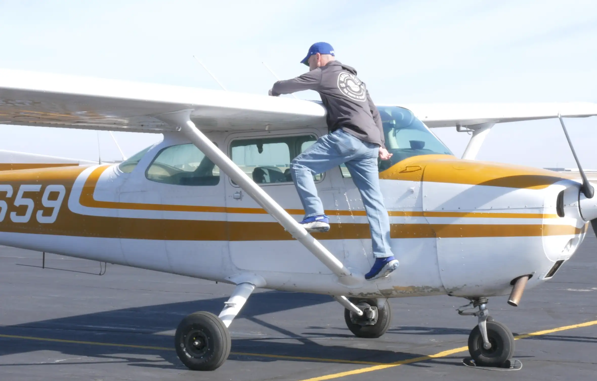 Pilot Instructional Center - Pilot preparing plane for flight school pilot training